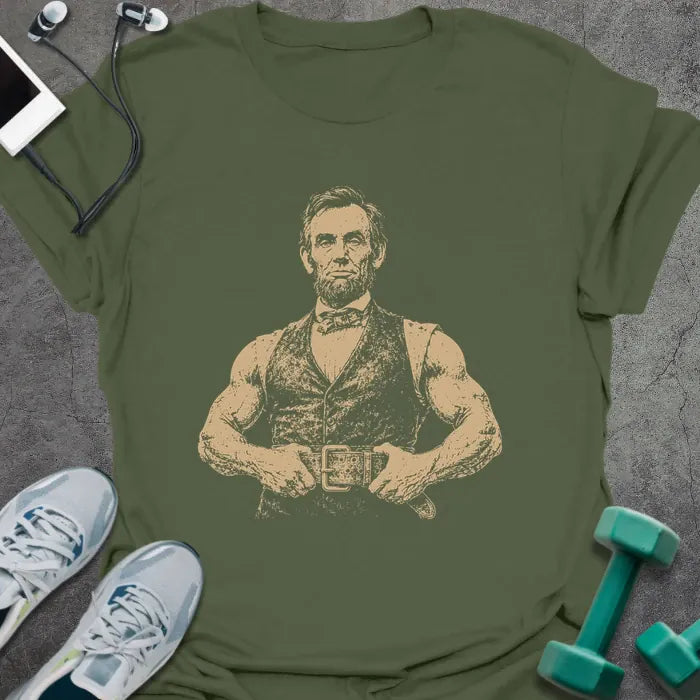 Military green t-shirt with a portrait of Abraham Lincoln flexing with crossed arms in white