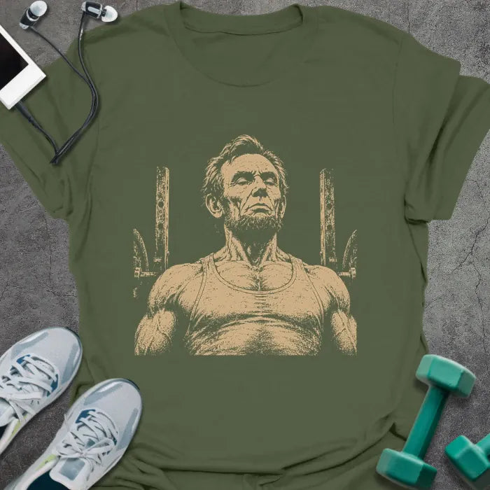 Military green t-shirt with a portrait of Abraham Lincoln flexing with both arms in white