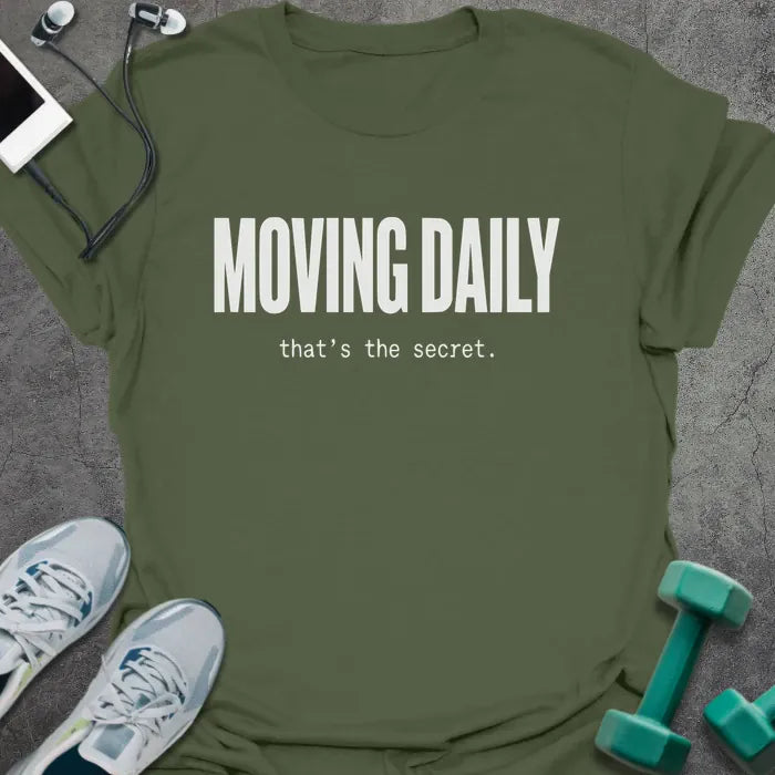 Military green t-shirt printed with "MOVING DAILY that's the secret." in white