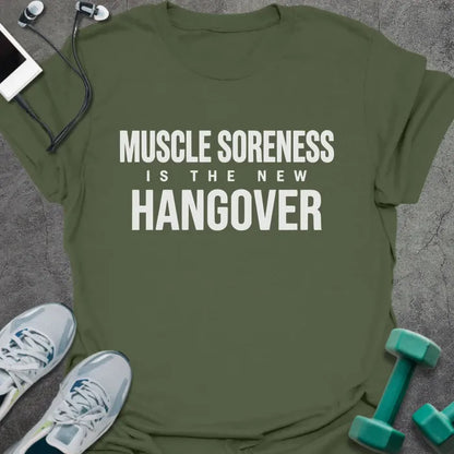 Military green t-shirt printed with "Muscle Soreness is the New Hangover" in white