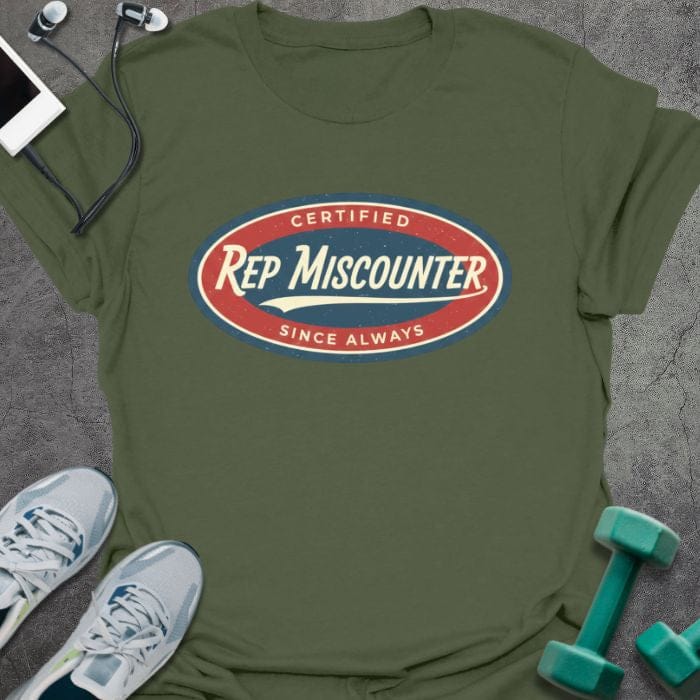 Military green t-shirt printed with "CERTIFIED Rep Miscounter SINCE ALWAYS" in red and blue