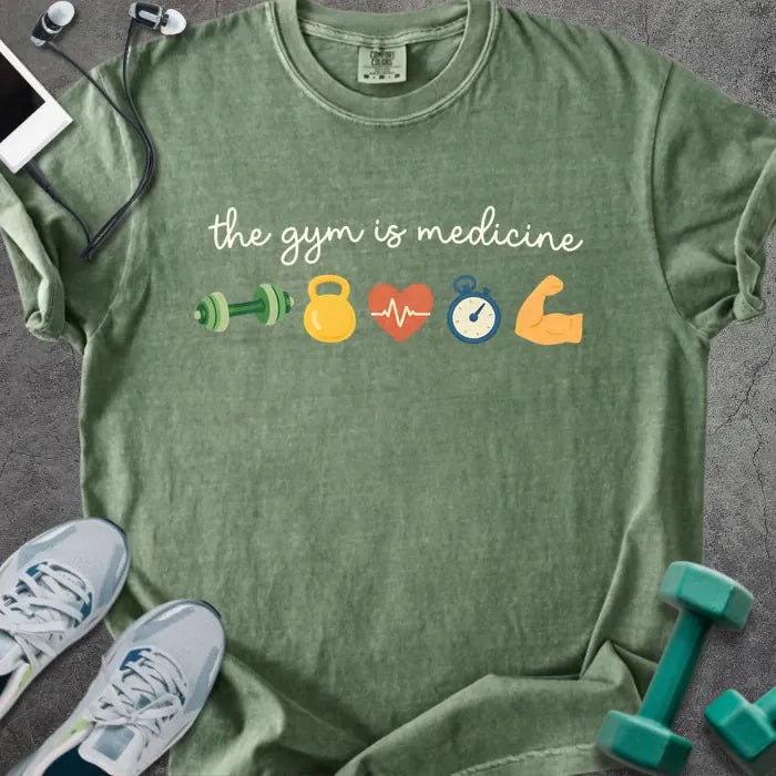 Moss t-shirt printed with "the gym is medicine 💪 🏋️ 💓 ⏰ 💪" in white and multicolor