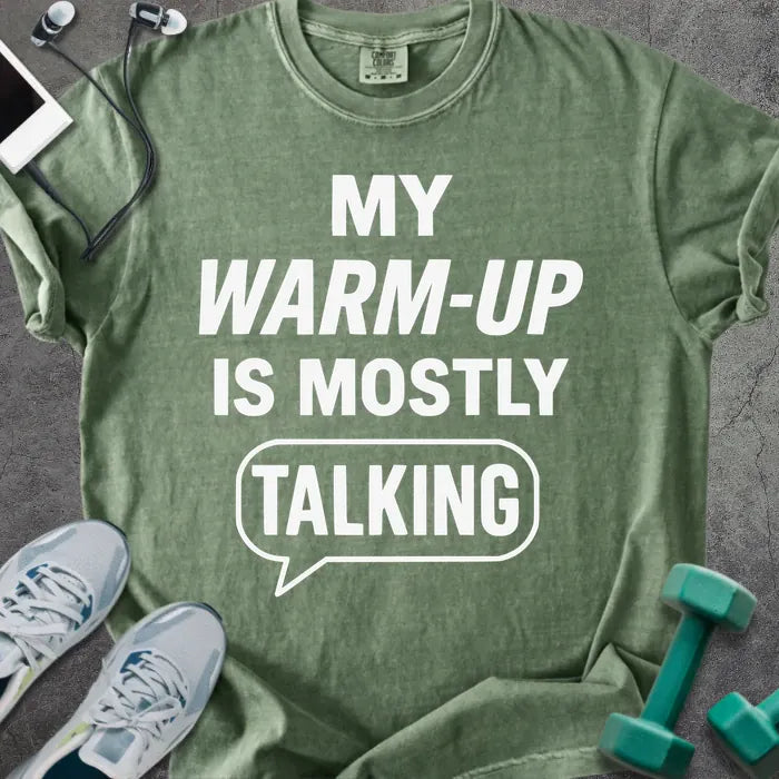 Moss t-shirt printed with "My Warm-up is Mostly Talking" in white, with a speech bubble graphic