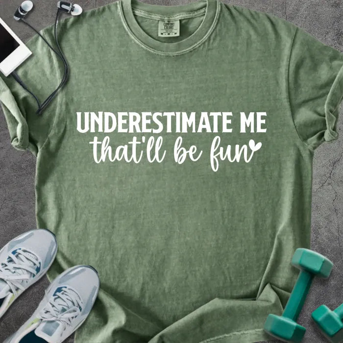 Moss t-shirt printed with "UNDERESTIMATE ME that'll be fun" in white