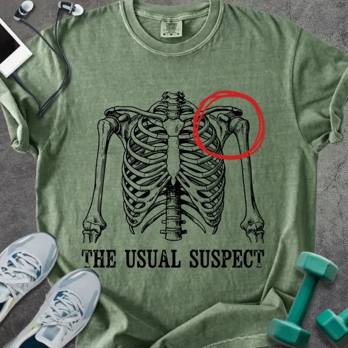 Moss t-shirt printed with "The Usual Suspect", with skeleton ribcage and red circled heart