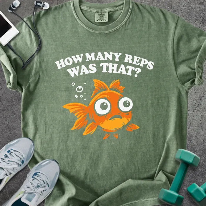 Moss t-shirt printed with "How Many Reps Was That?", with an illustration of a wide-eyed goldfish and bubbles