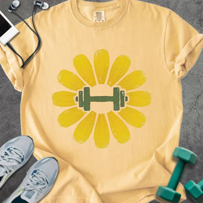 Mustard t-shirt with yellow dandelion flower and dumbbell in center in yellow and green