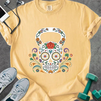 Mustard t-shirt with a floral skull kettlebell graphic in multicolor