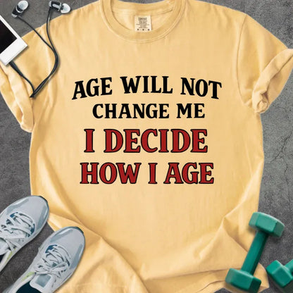 Mustard t-shirt printed with "Age Will Not Change Me I Decide How I Age" in red