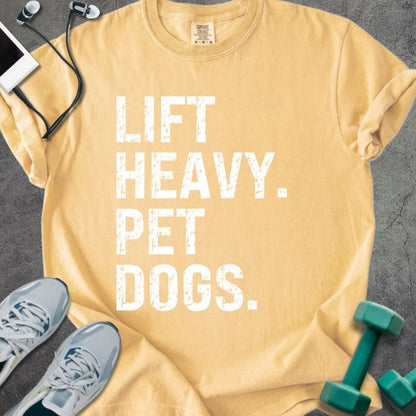 Mustard t-shirt printed with "Lift Heavy. Pet Dogs." in white