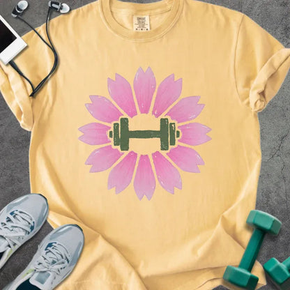 Mustard t-shirt with pink sakura flowers and barbell in center in pink and green