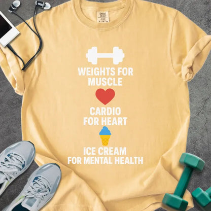 Mustard t-shirt printed with "Weights for Muscle Cardio for Heart Ice Cream for Mental Health" in red, blue, yellow, with a dumbbell, heart, and ice cream cone icon between the lines