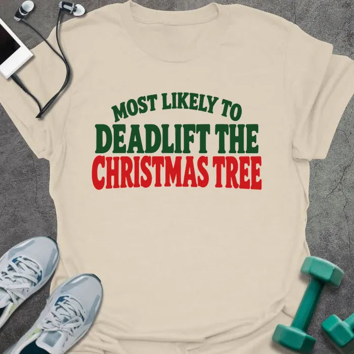 Natural t-shirt printed with "MOST LIKELY TO DEADLIFT THE CHRISTMAS TREE" in green and red