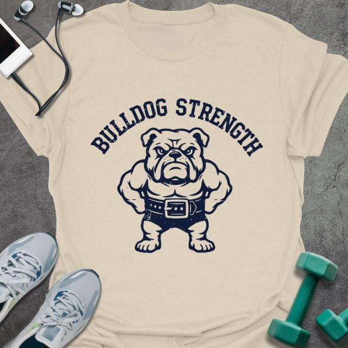 Cream t-shirt printed with "Bulldog Strength", with a muscular bulldog wearing a lifting belt