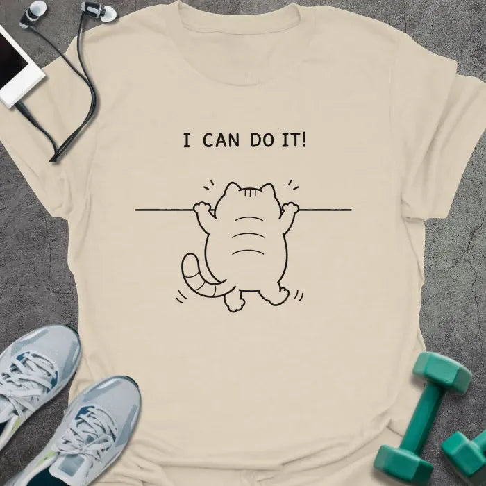 Natural t-shirt printed with "I CAN DO IT!" in black, with cat attempting pullup