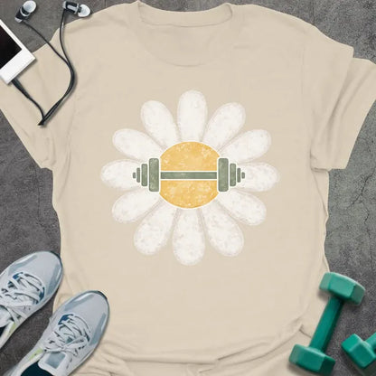 Cream t-shirt with a white daisy featuring a barbell at its center with green and white elements in white, yellow, and green