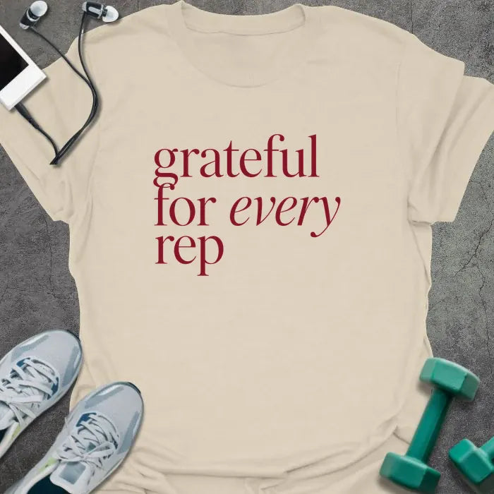 Natural t-shirt printed with "grateful for every rep" in burgundy