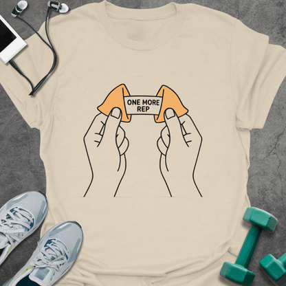 Cream t-shirt with a fortune cookie and two lemons connected by a barbell