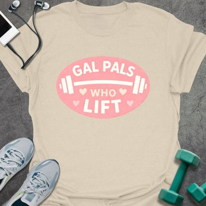 Cream t-shirt printed with "Gal Pals Who Lift" in white, pink, with a barbell