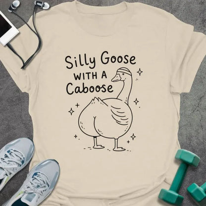 Natural t-shirt printed with "Silly Goose WITH A Caboose" in black, with goose with sparkles
