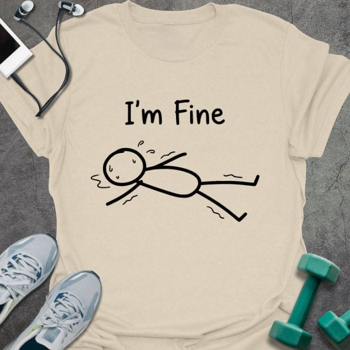 Cream t-shirt printed with "I'm Fine" in black, with an illustration of a stick figure on the ground