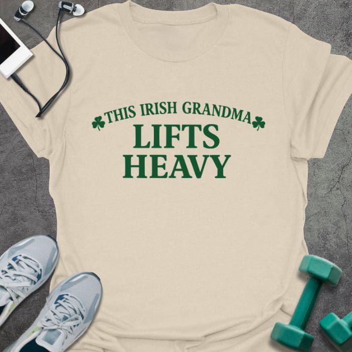 Cream t-shirt printed with "This Irish Grandma Lifts Heavy" in green, with clover
