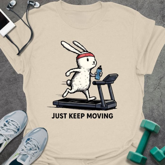 Cream t-shirt printed with "Just Keep Moving", with a rabbit on a treadmill