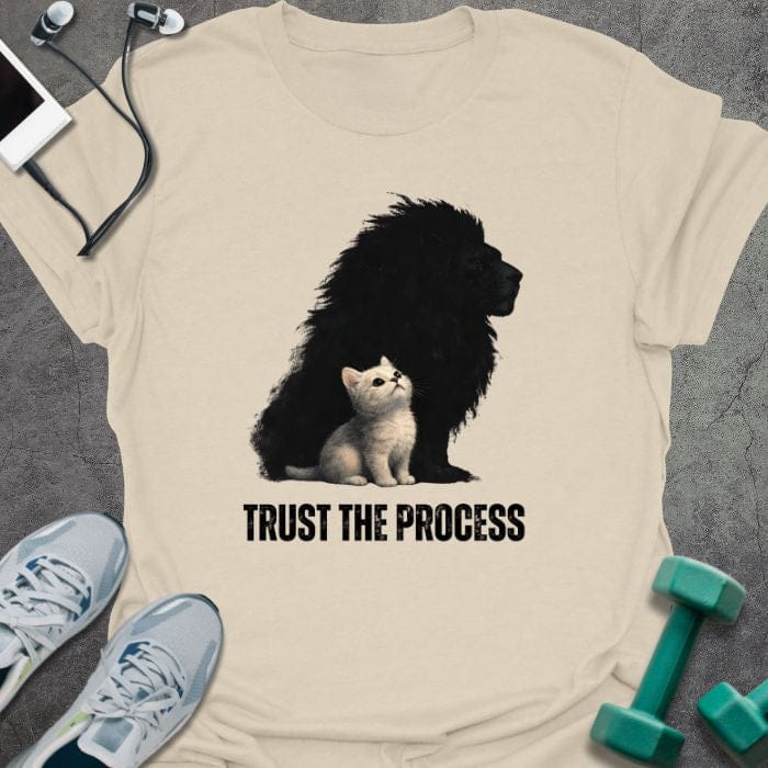 Cream t-shirt printed with "Trust the Process", with a white kitten casting a lion shadow