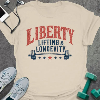 Cream t-shirt printed with "Liberty Lifting & Longevity" in blue and red, with a barbell and stars