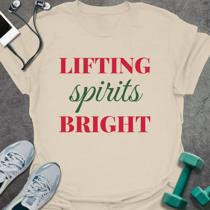 Natural t-shirt printed with "LIFTING spirits BRIGHT" in red and green