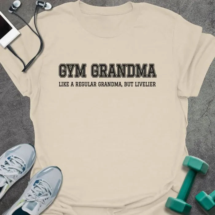 Natural t-shirt printed with "GYM GRANDMA, LIKE A REGULAR GRANDMA, BUT LIVELIER" in charcoal varsity letters