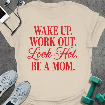 Cream t-shirt printed with "WAKE UP. WORK OUT. Look Hot. BE A MOM." in red