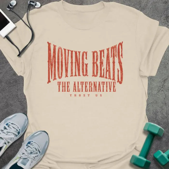 Natural t-shirt printed with "MOVING BEATS THE ALTERNATIVE TRUST US" in coral