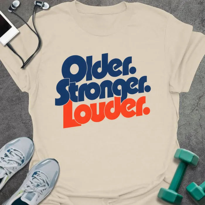 Natural t-shirt printed with "Older. Stronger. Louder." in navy blue with orange bold lettering