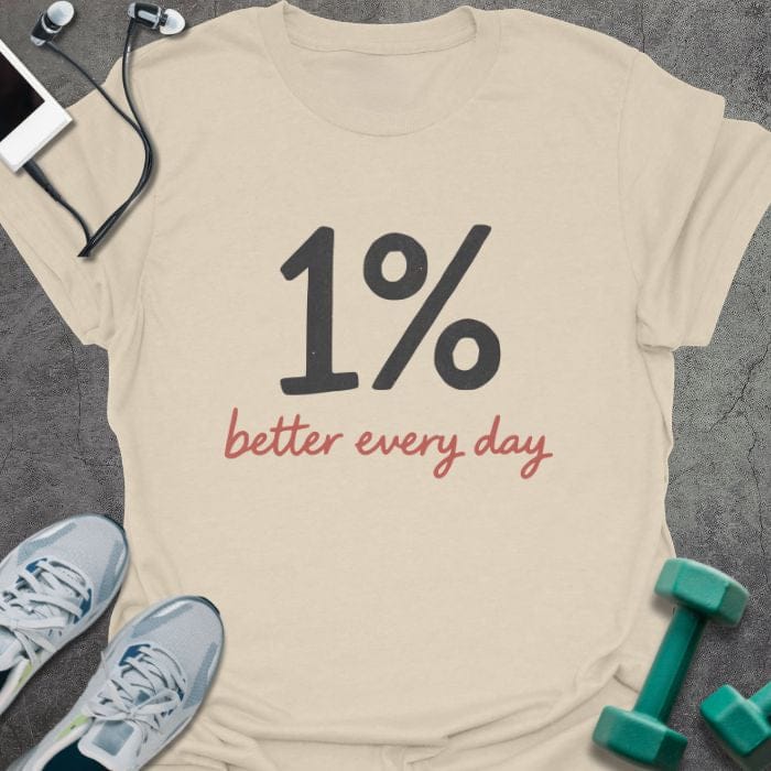 Cream t-shirt printed with "1% better every day" in black, rust red