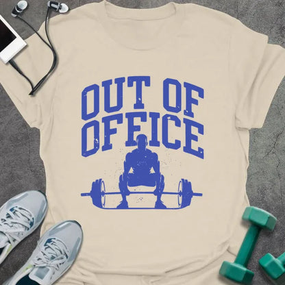 Cream t-shirt printed with "Out of Office" in blue, with a figure squatting