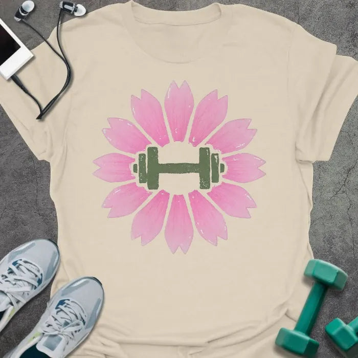 Cream t-shirt with an illustration of pink sakura flowers surrounding a dumbbell in pink and green