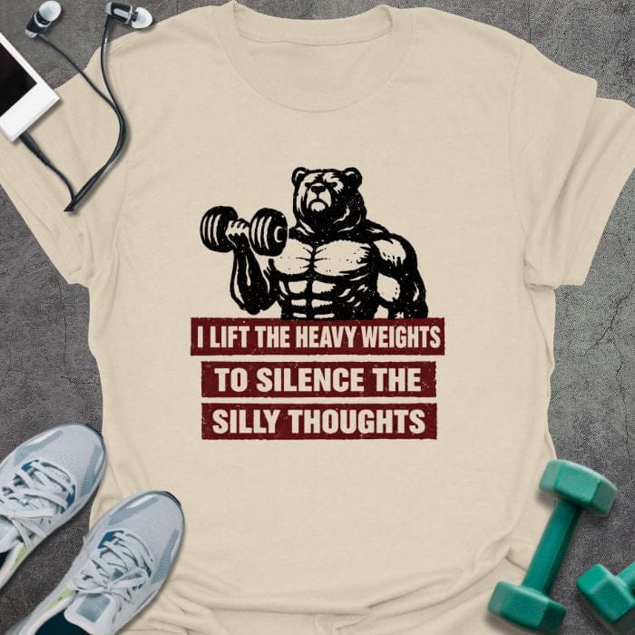 Cream t-shirt printed with "I Lift the Heavy Weights to Silence the Silly Thoughts" in red and black, with muscular bear lifting dumbbell