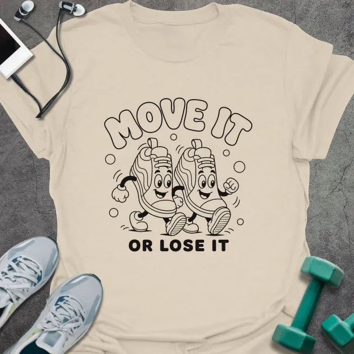 Natural t-shirt printed with "MOVE IT OR LOSE IT" in black line art with two anthropomorphic sneakers