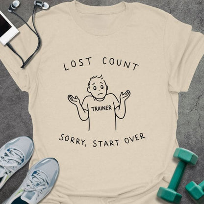 Cream t-shirt printed with "Lost Count Sorry, Start Over", with stick figure with raised arms