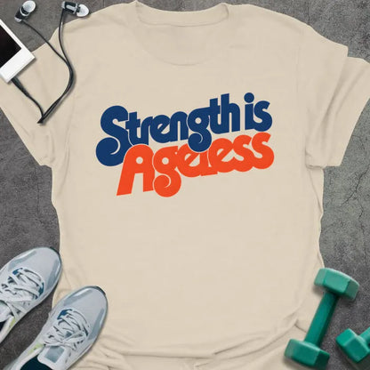 Natural t-shirt printed with "Strength is Ageless" in blue and red lettering