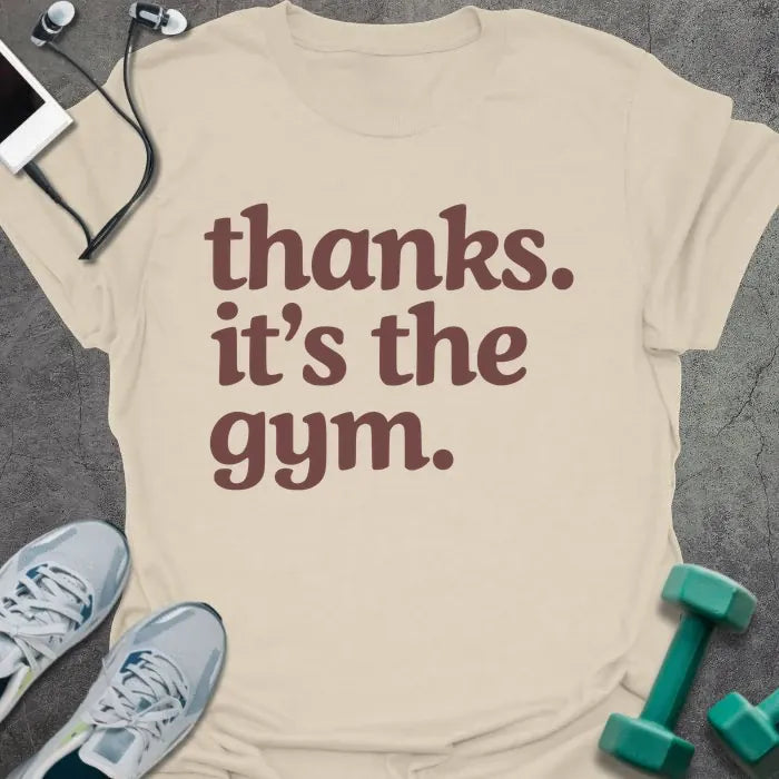 Cream t-shirt printed with "thanks. it's the gym." in red