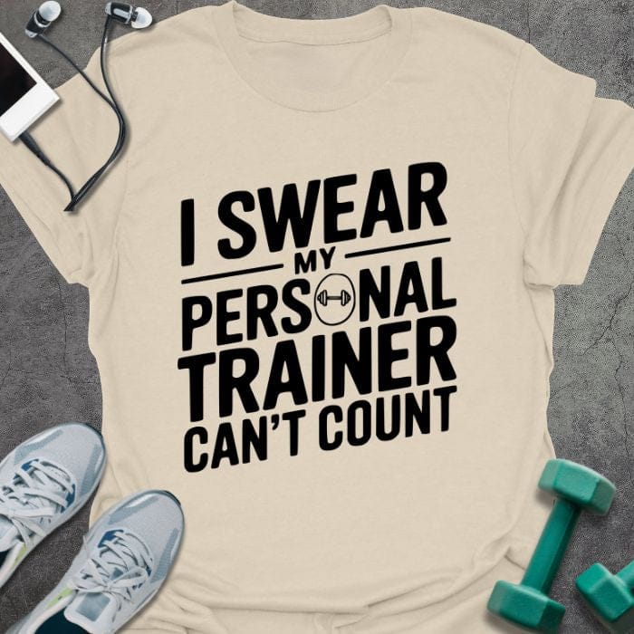 Cream t-shirt printed with "I Swear my Personal Trainer Can't Count"
