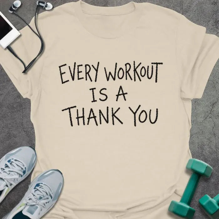 Natural t-shirt printed with "EVERY WORKOUT IS A THANK YOU" in black handwritten-style text