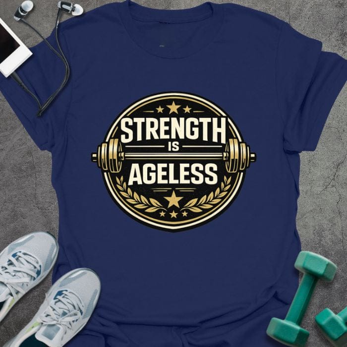 Navy t-shirt printed with "Strength is Ageless" in gold and white, with a circular barbell badge and stars