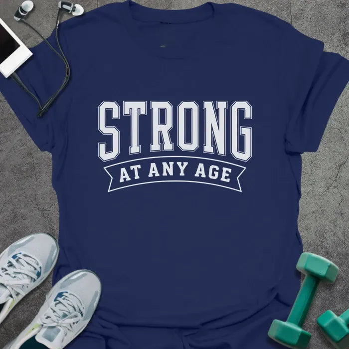 Navy t-shirt printed with "Strong at Any Age" in white, with a decorative banner