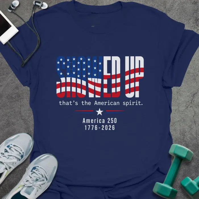 Navy t-shirt printed with "FIND UP that's the American spirit. America 250 1776-2026" in white and red, with an American flag graphic