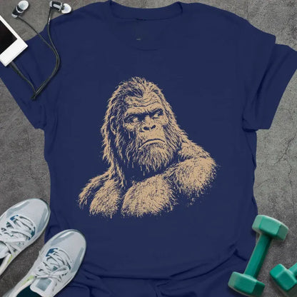 Navy t-shirt with an illustration of Bigfoot's face looking to the side in white