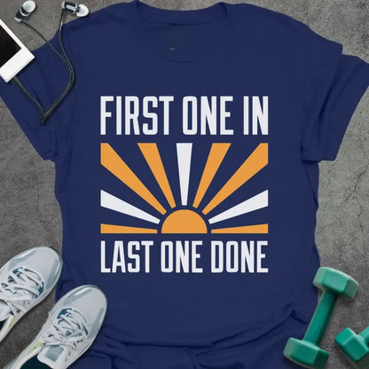 Navy t-shirt printed with "First One in Last One Done" in orange and white, with sun graphic