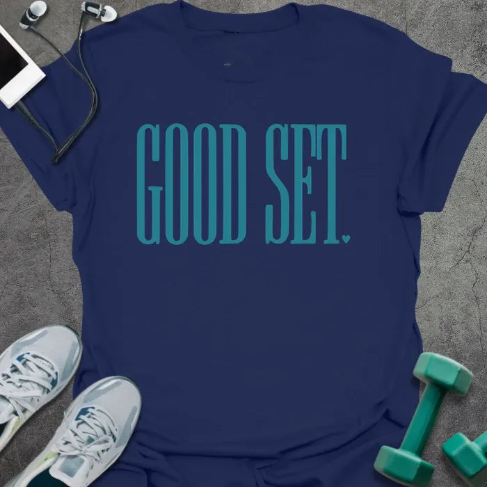 Navy t-shirt printed with "Good Set." in teal
